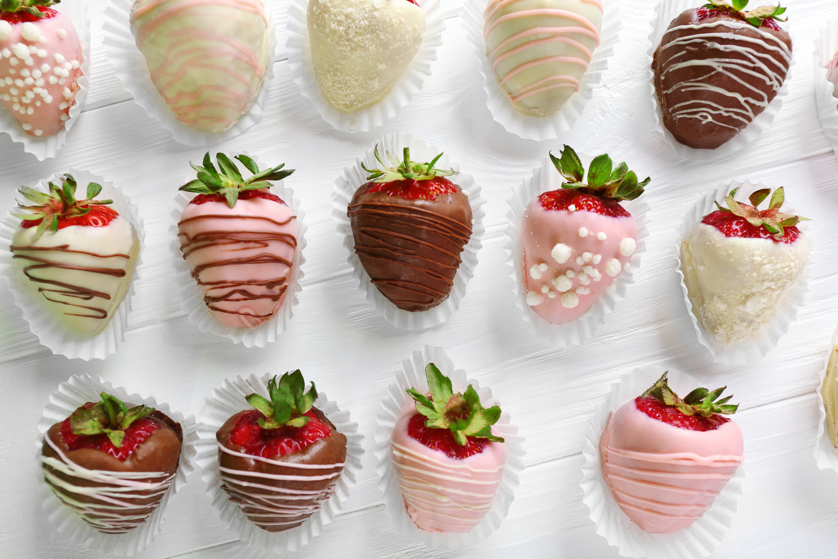 Strawberries Covered with  Different Chocolate on White  Wooden Background